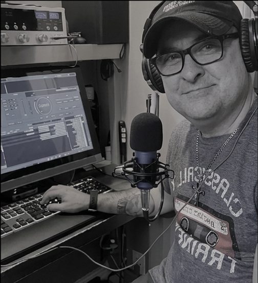 Kenny Walsh at the microphone in the K-Lee Radio studio